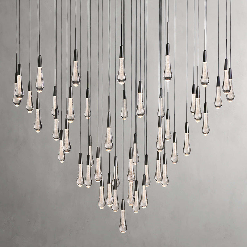 North America Arhaus Villa: Open-concept duplex staircase with long, understated luxury crystal living room lights and copper pendant lights