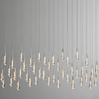 North America Arhaus Villa: Open-concept duplex staircase with long, understated luxury crystal living room lights and copper pendant lights