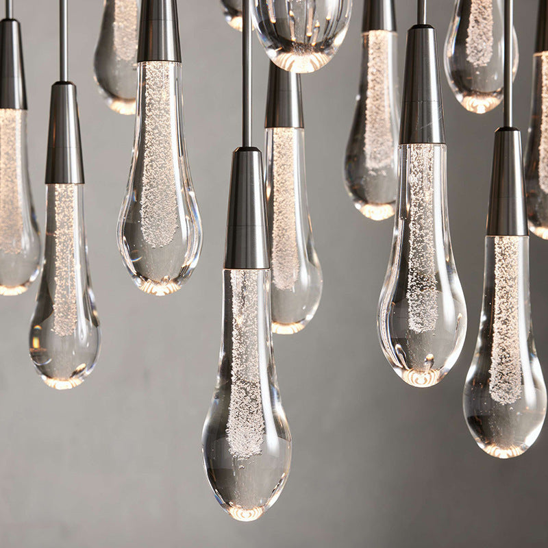 North America Arhaus Villa: Open-concept duplex staircase with long, understated luxury crystal living room lights and copper pendant lights