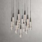 North America Arhaus Villa: Open-concept duplex staircase with long, understated luxury crystal living room lights and copper pendant lights